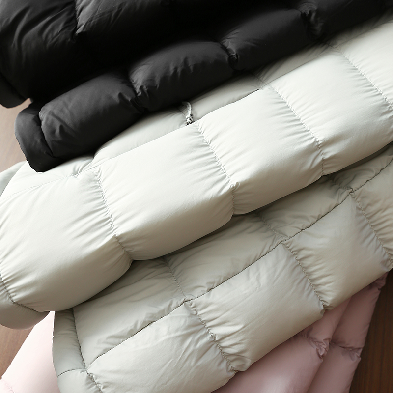 淘么淘 柔软轻暖 可溯源90白鸭绒户外防水立领连帽排骨羽绒服女
