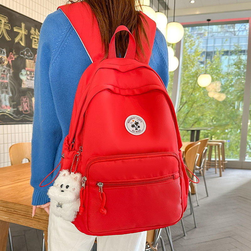 红色书包女大学生简约百搭大容量电脑背包韩版初中生高颜值双肩包