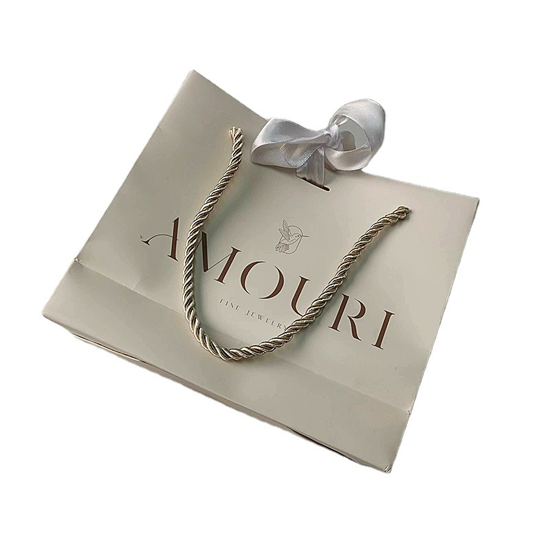 手提袋纸袋定制工厂价格设计LOGO银箔冲压白色纸袋，带白色丝带包