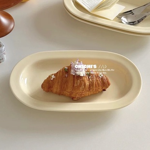 INS风淡奶黄色简约椭圆陶瓷餐盘博主款托盘家用鱼盘早餐点心盘子