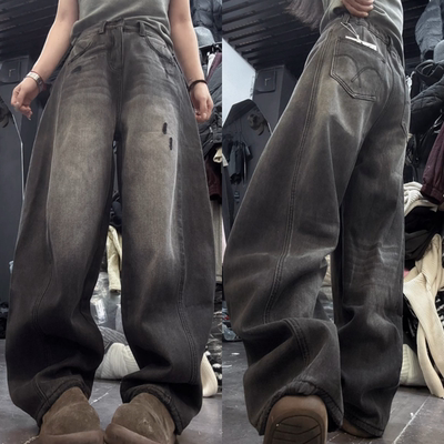 做旧破洞设计弯刀牛仔裤