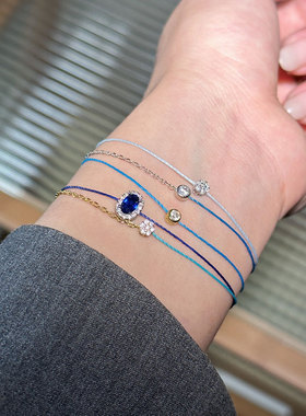 莱克因蓝梦幻淡蓝圆钻红绳手链