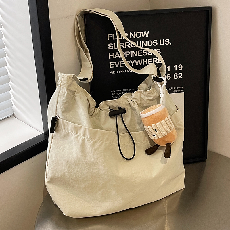 帆布抽绳水桶包女2024新款
