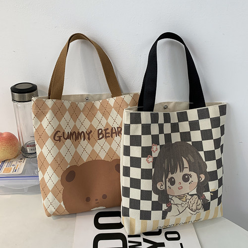 小众通勤包包女2026新款时尚款手提帆布包大容量水桶托特饭盒包 - 封面