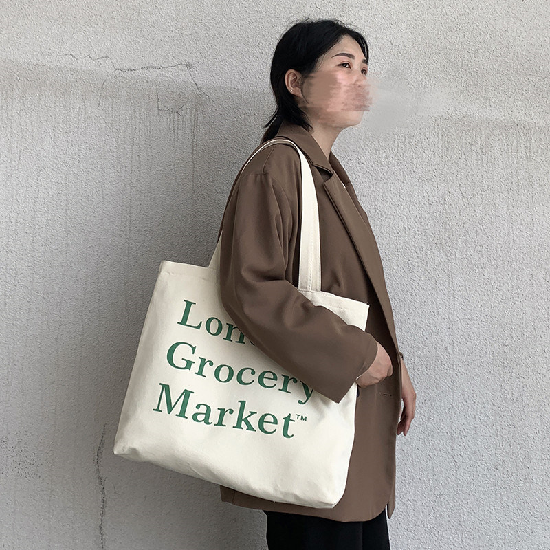 今年流行包包夏大容量女字母大号可爱通勤学生帆布手提书包环保袋