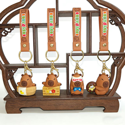 软胶创意卡通度假卡皮巴拉钥匙扣可爱骑车水豚摸鱼水豚钥匙链礼品
