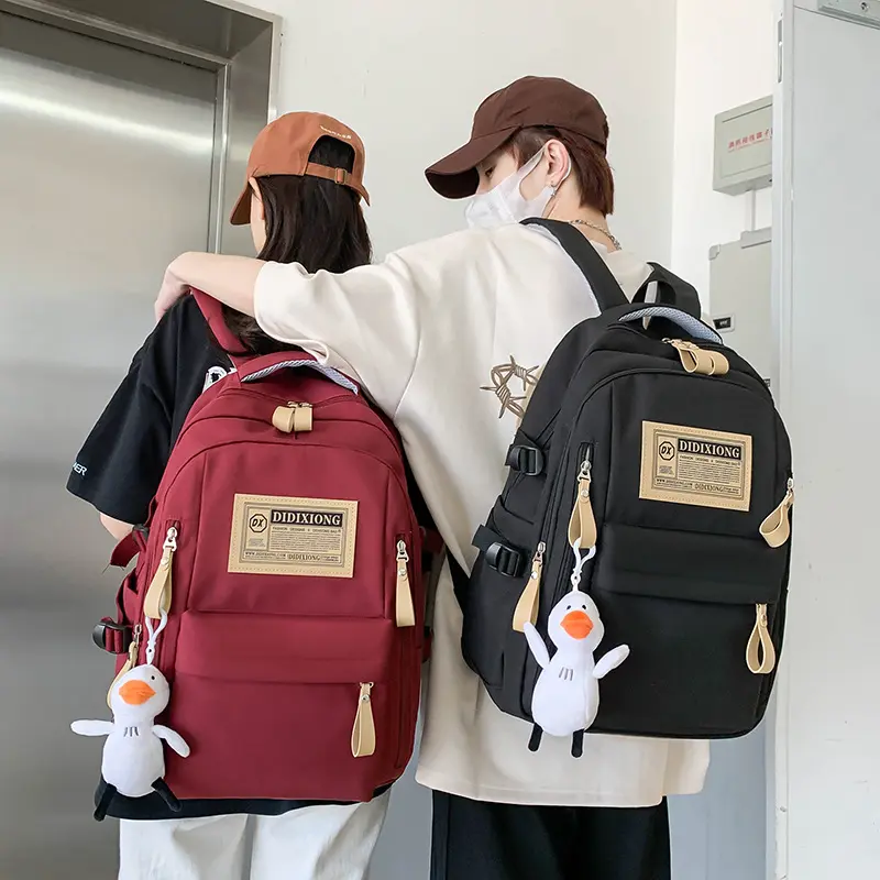 新款书包女大学生高中生中学生双肩包简约减负大容量男生背包