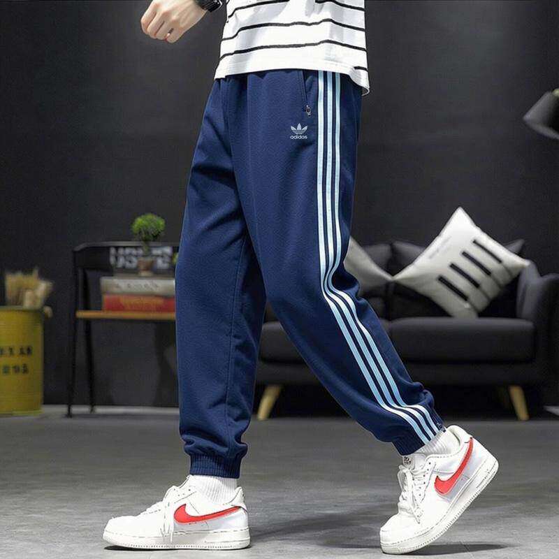 Adidas阿迪达斯三叶草薄款裤子男透气蓝色宽松美式梭织束脚运动裤