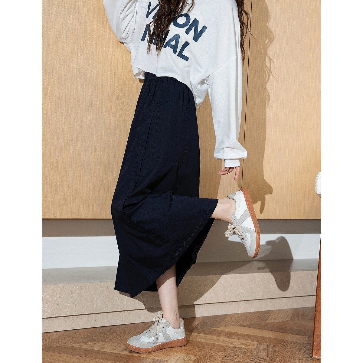 唐狮2026春秋新款女半身裙长款显瘦遮肉流行藏青色a字裙子WP