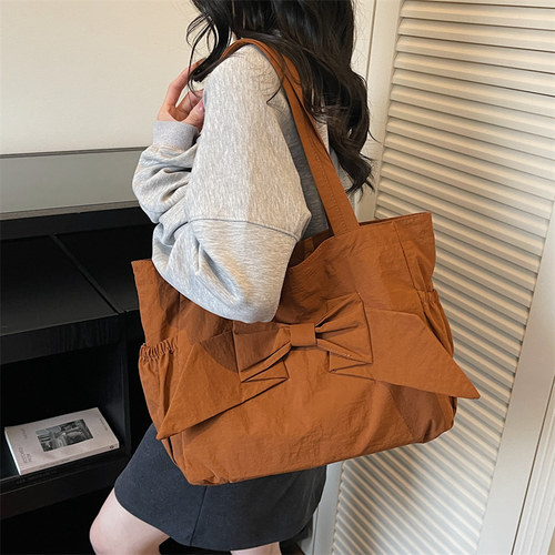 小众设计感蝴蝶结单肩包女学生大容量通勤托特包轻便尼龙帆布包女