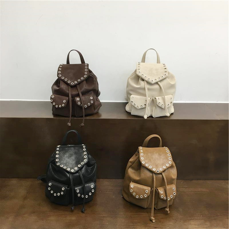 小脏柜 双肩包包女士2026新款小众复古铆钉背包休闲抽绳学生背包