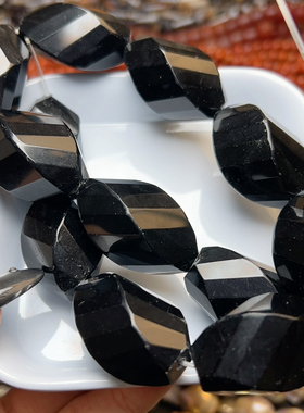 C537 19*33mm天然黑玛瑙刻面扭珠一条