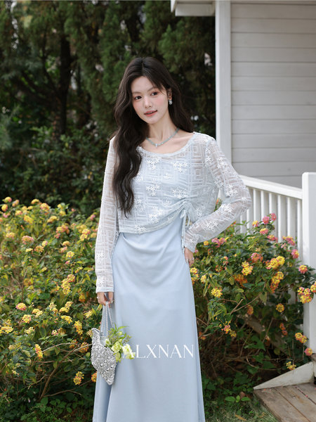 Model wearing a light blue lace long dress outdoors