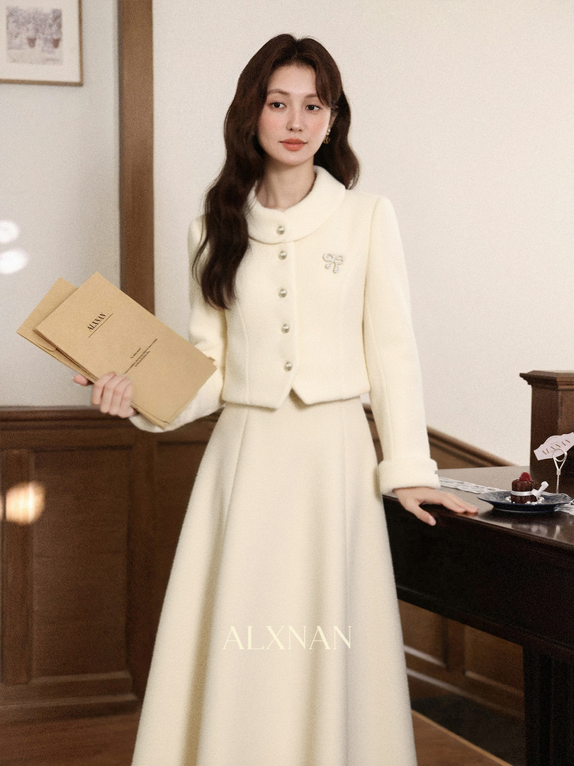 Cream long-sleeve dress with matching cropped jacket worn by a model