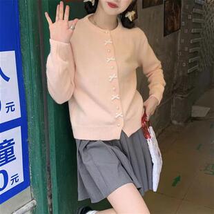 春秋蝴蝶结珍珠纽扣毛衣女款高级感韩系温柔风淡黄色针织外套圆领