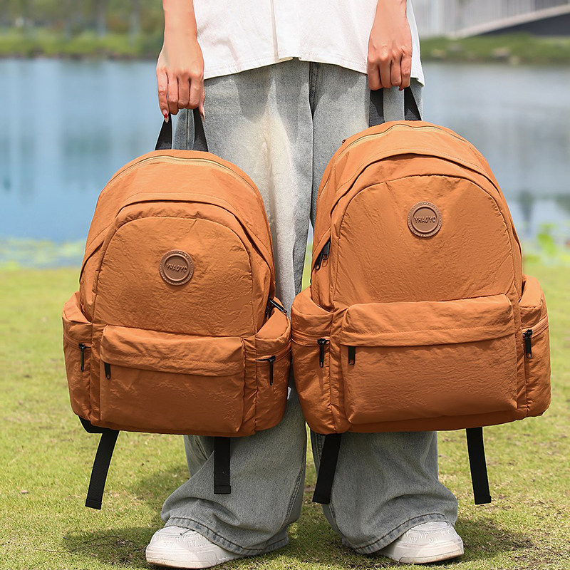 红鹮鸟户外轻便大容量双肩包女2026旅行防水电脑背包男书包