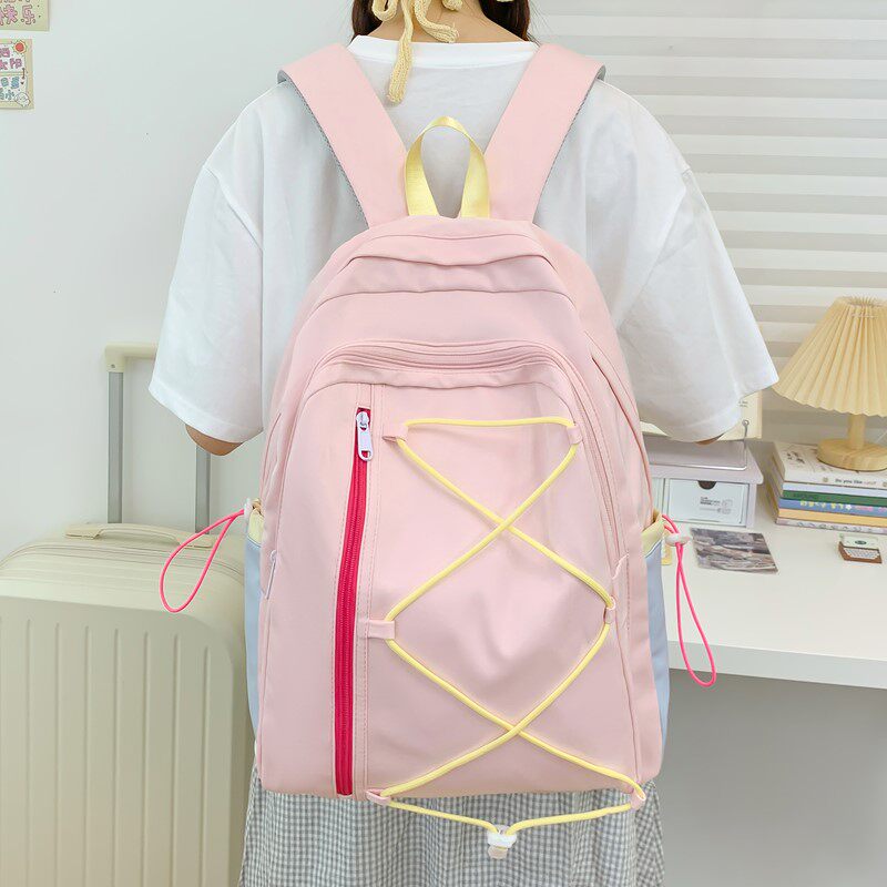 红鹮鸟轻便小众设计简约时尚初高中学生书包小清新百搭绑带双肩包