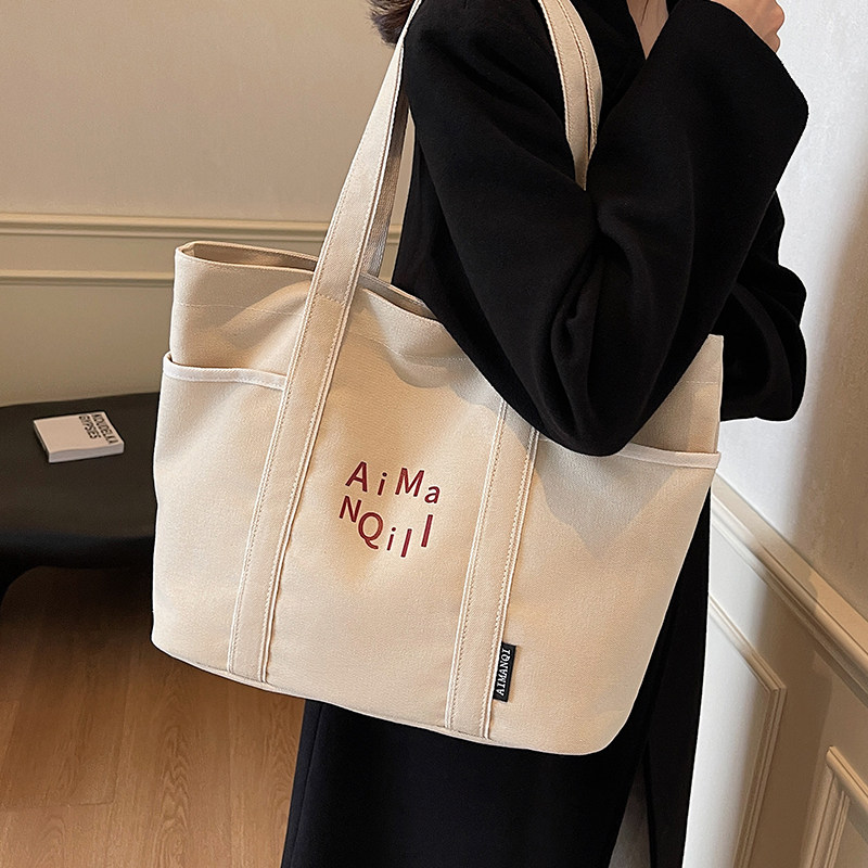 休闲帆布包包女式2025年秋新款百搭单肩包大容量托特包上课通勤包,箱包皮具/热销女包/男包,托特包,淘宝优惠券,粉丝福利购,淘宝优惠卷