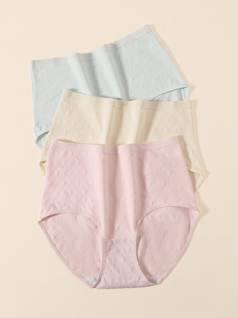 Pastel-colored seamless underwear briefs laid flat