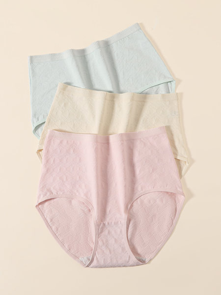 Pastel-colored seamless underwear briefs laid flat