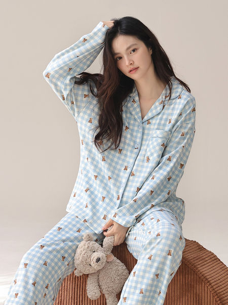 Model wearing light blue gingham teddy bear print pajama set