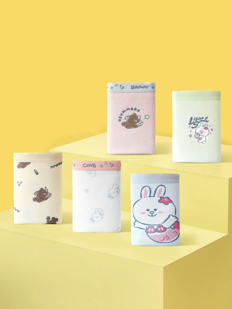 Assorted cartoon-printed underwear briefs displayed on a yellow background
