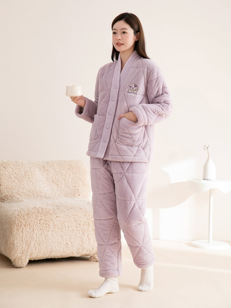 Woman wearing a lavender quilted loungewear pajama set
