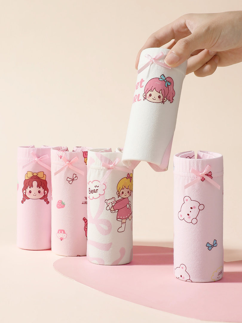 Pink and white cute cartoon-printed rolled socks displayed on a pastel background