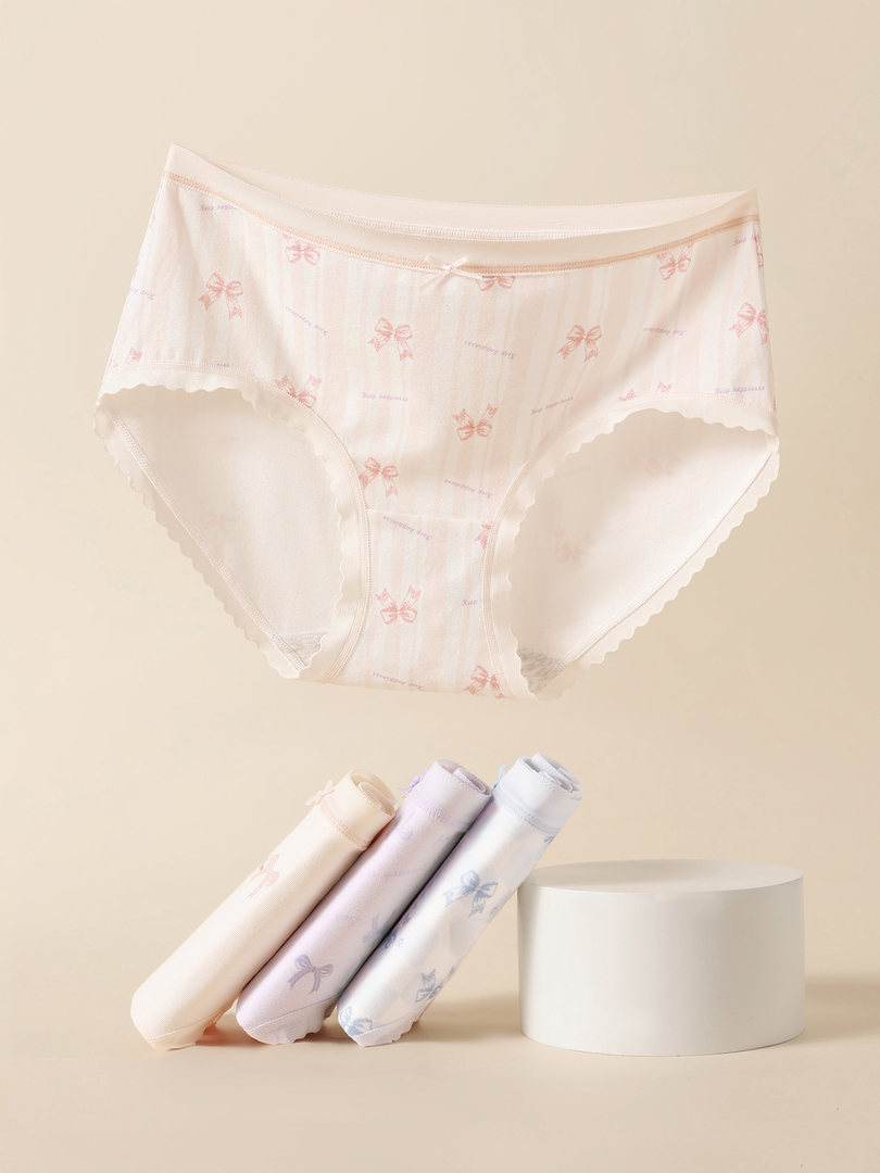 Pastel printed women’s underwear briefs on a beige background