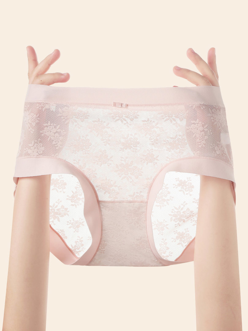 Pink lace women's underwear held up by hands