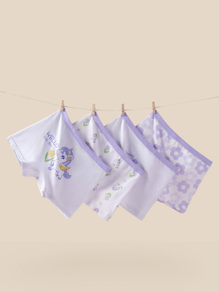 Pastel purple children's underwear set with cartoon floral prints hung on a clothesline