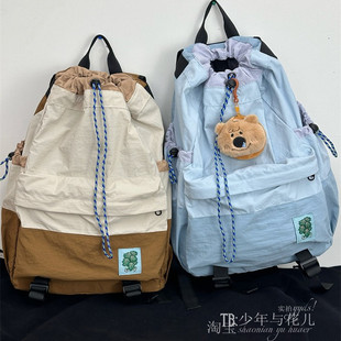 户外徒步风抽绳束口拼色轻量化双肩包高颜值羽毛球包学生上课包女