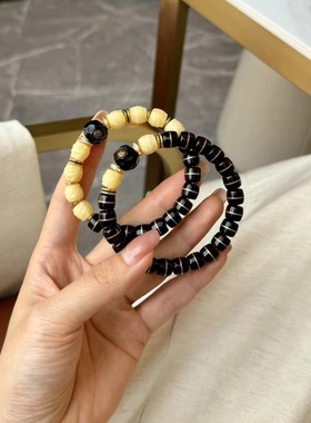 黑金镶铜丝椰蒂情侣手串，搭配驼骨无相桶珠，纯铜钻片、隔片等