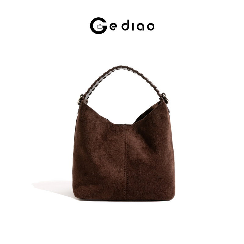 格调studio复古轻奢编织pu肩带女包2025秋冬水桶包小众手提单肩包