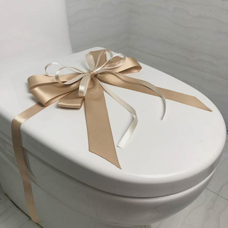 样板房间卫生间马桶装饰蝴蝶结拉花卫浴展厅新房交付绑花封条摆件
