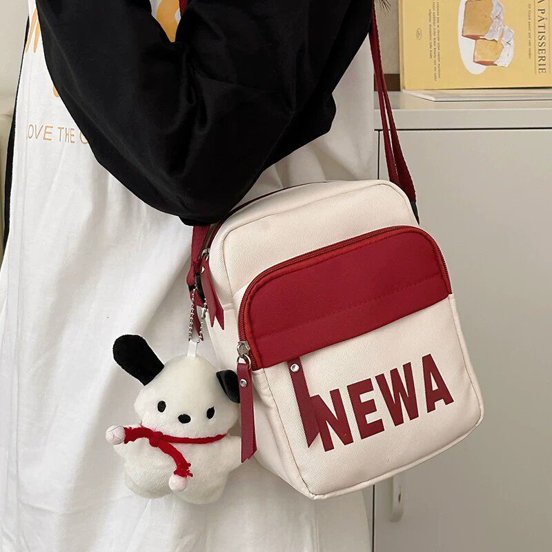 儿童斜挎包女孩外出旅游小包包2026新款小学生可爱轻便手机单肩包