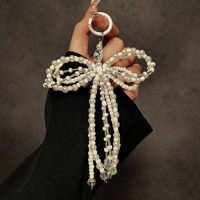 ins小众冷淡个性创意蝴蝶结珍珠串珠手机通用挂链车钥匙包包挂件