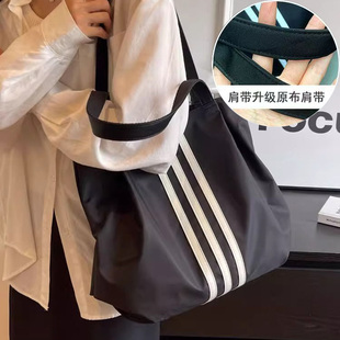 单肩帆布包女2025新款大容量学生通勤托特包简约百搭手拎手提袋