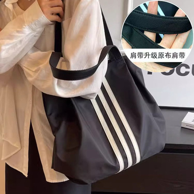 单肩帆布包女2025新款大容量学生通勤托特包简约百搭手拎手提袋