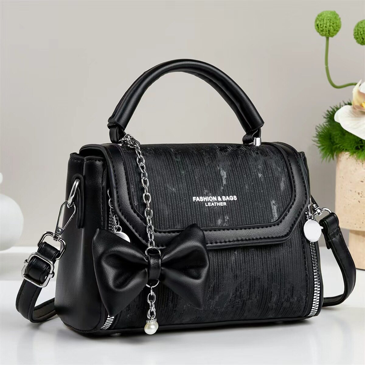 香港真皮包包蝴蝶结手提包女黑色妈妈包链条斜挎包高级感单肩包