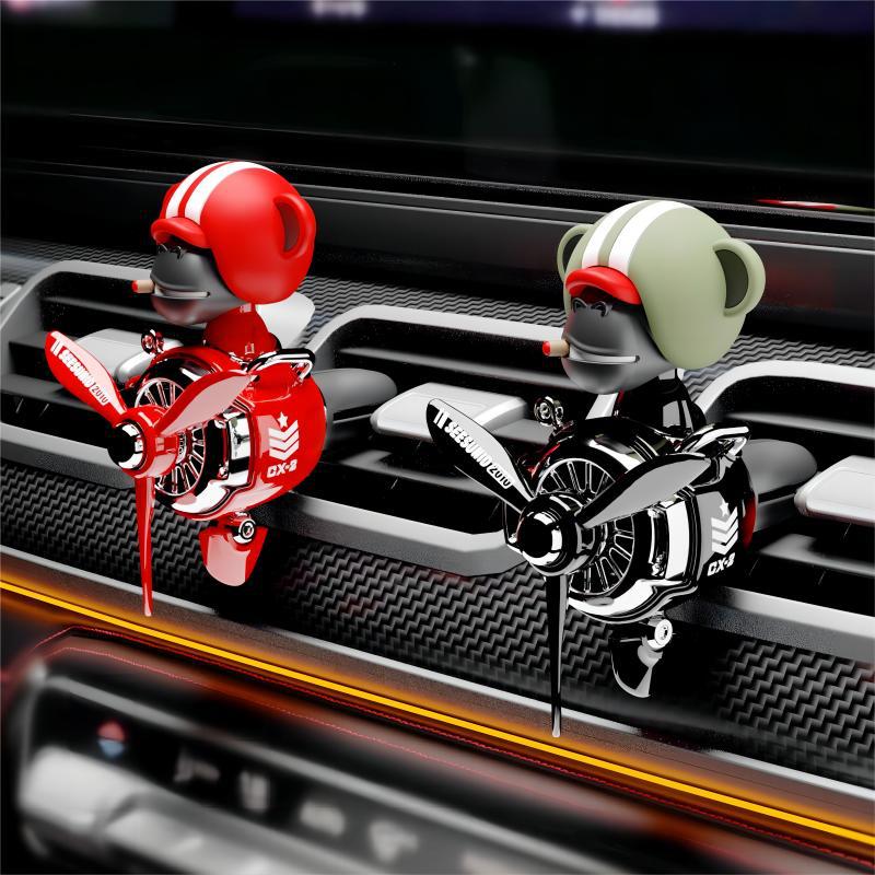 新款小飞机车载香薰创意潮品摇头公仔战斗机出风口香薰汽车