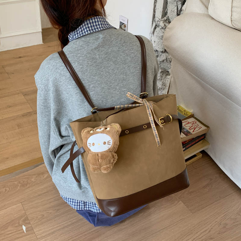 韩里韩气的棕色双肩包女2025新款日常通勤百搭水桶包复古托特包潮