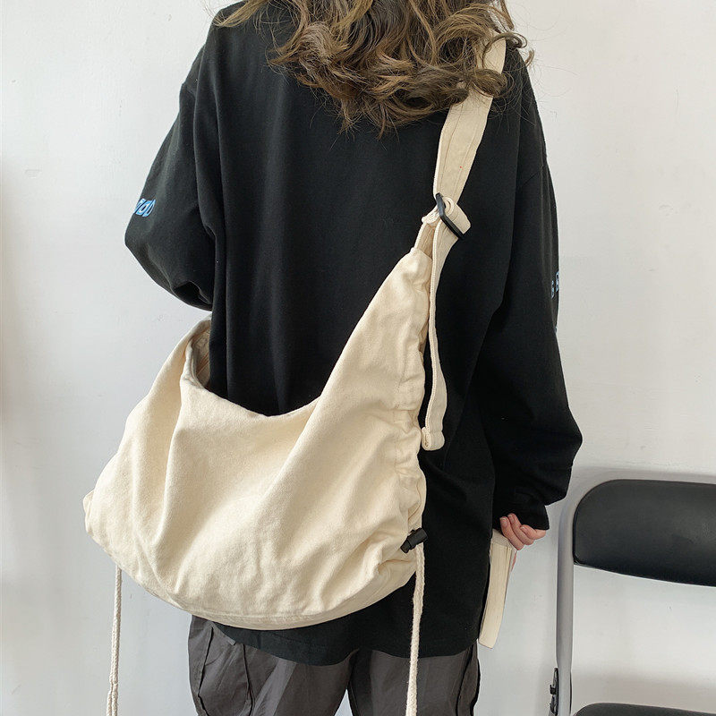斜挎帆布包女chic港风大容量日系百搭学生单肩ins斜跨包饺子包包