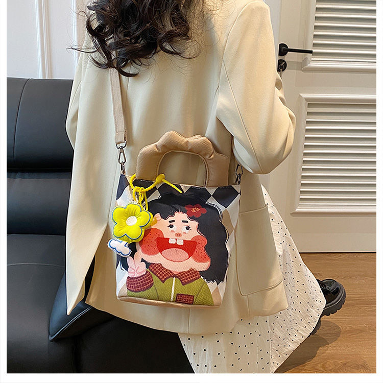 春季日系插画设计水桶包可爱帆布包手提包搞怪卡通单肩斜挎包背包