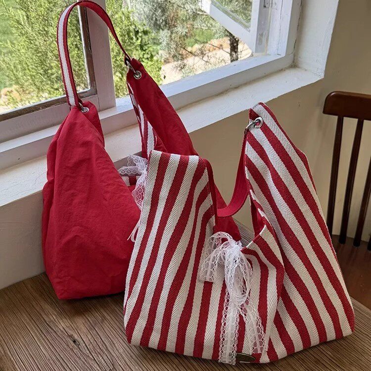 双面条纹帆布包包女2026新款通勤单肩腋下包大容量百搭手拎手提袋