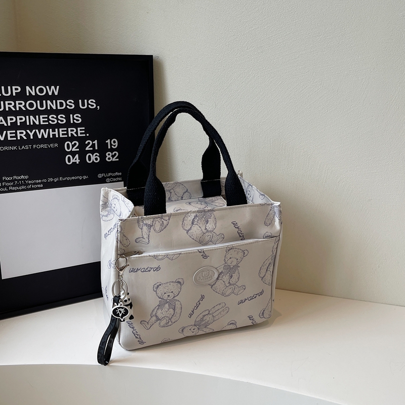 可爱卡通印花通勤上班族百搭宝妈斜挎包帆布包饭盒袋子午餐便当包