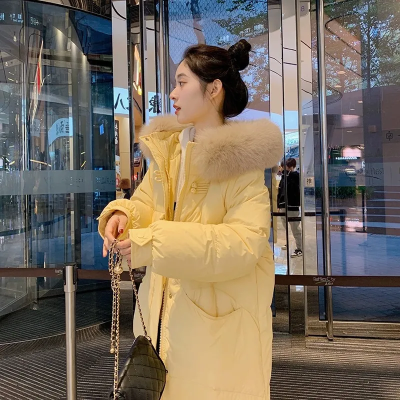 中长款羽绒服女2025年新款韩版宽松时尚加厚冬季90白鸭绒奶黄外套