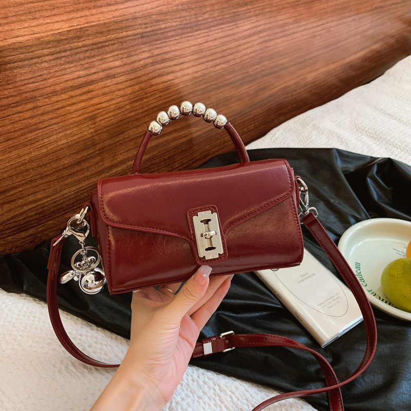 安哥拉红色爆款超火小拎包包女2025新款轻奢小众高级感手提斜挎包