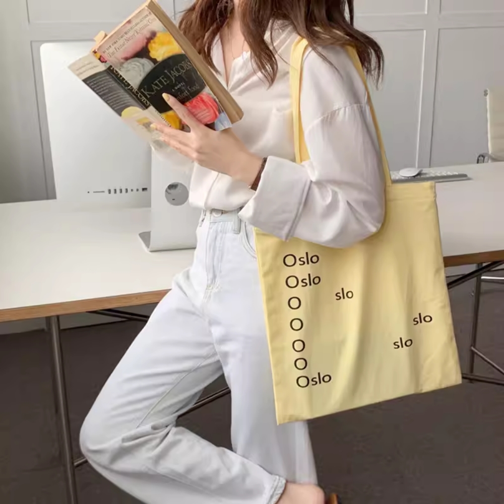 奶油鹅黄色女帆布单肩拉链托特包
