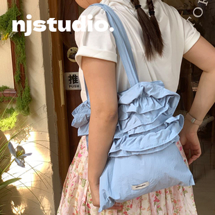 奶蓝色小众设计单肩包大容量女款休闲春夏帆布包百搭上课通勤包包